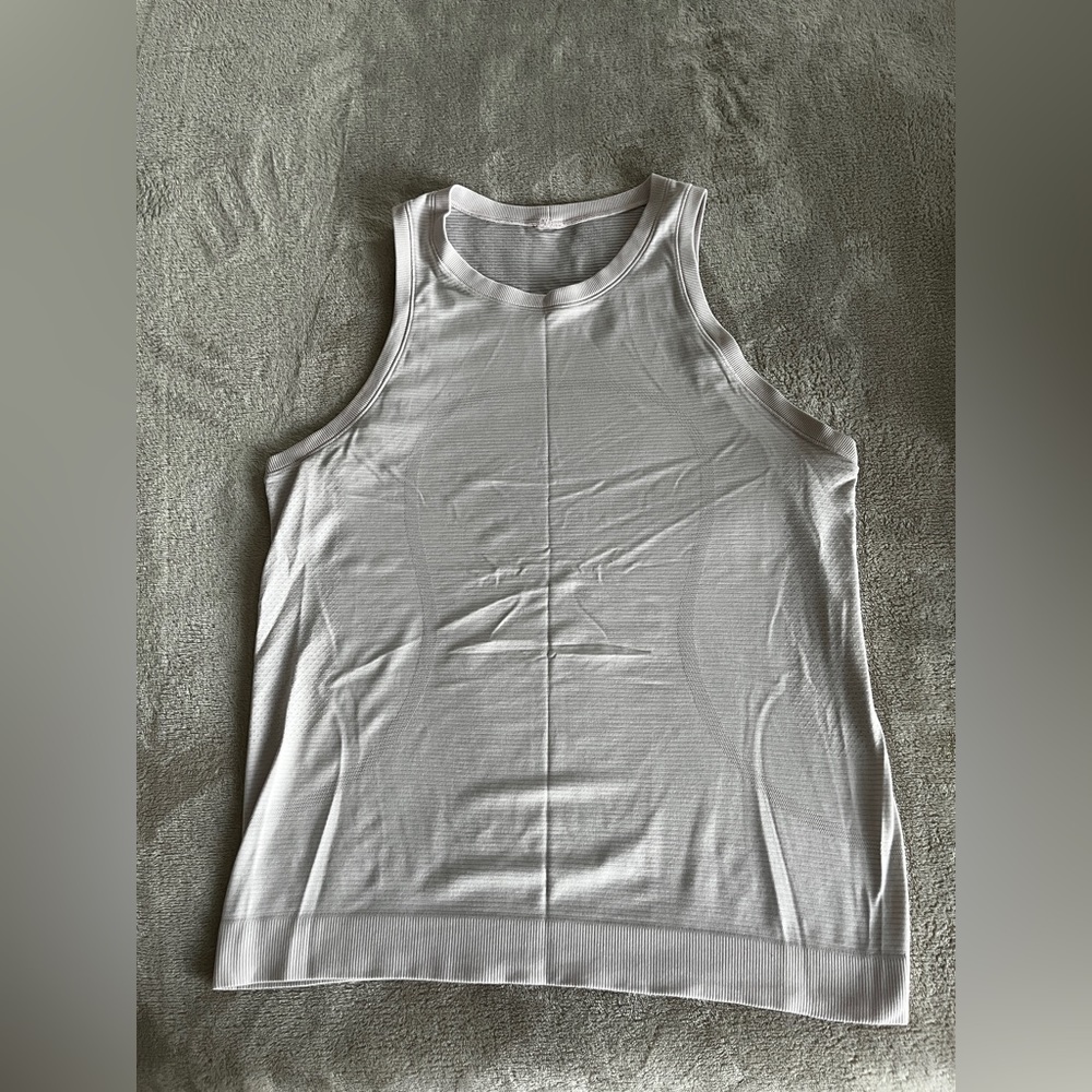 Lululemon blush colored tank.  NO size tag fits like size 6